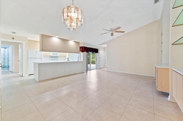 unfurnished living room with ceiling fan with notable chandelier, vaulted ceiling, and light tile patterned flooring