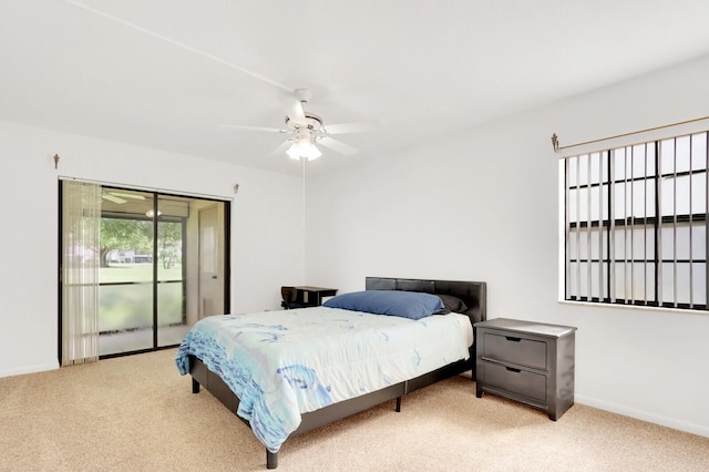 carpeted bedroom featuring ceiling fan and access to exterior