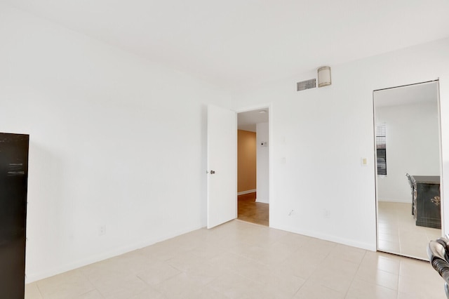 unfurnished bedroom featuring light tile patterned floors