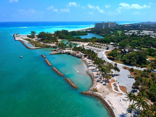 bird's eye view with a water view and a beach view