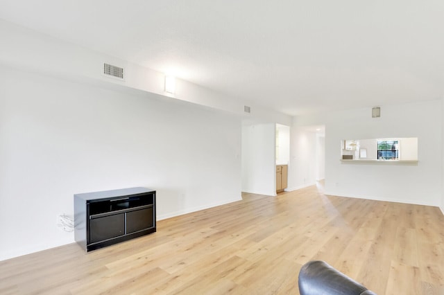 unfurnished living room with light hardwood / wood-style flooring