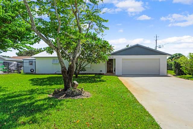 ranch-style home with a front lawn and a garage