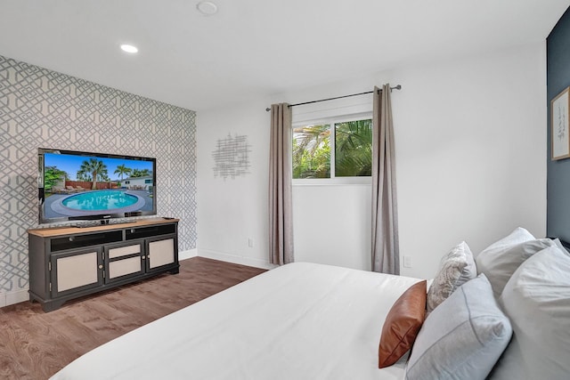 bedroom with hardwood / wood-style flooring