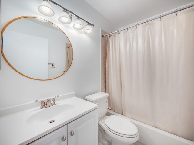 full bathroom with shower / bath combo, vanity, and toilet