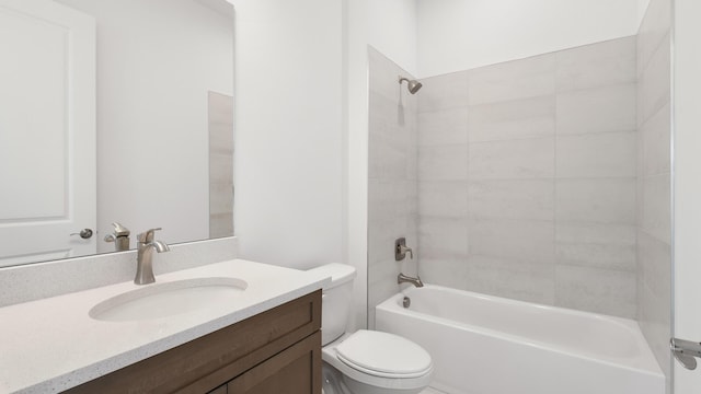 full bathroom featuring vanity, toilet, and tiled shower / bath