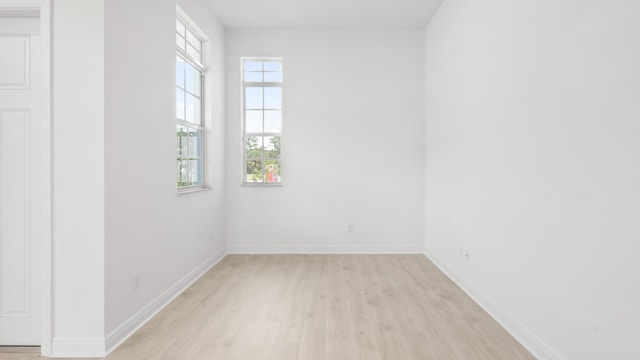 unfurnished room featuring light wood-type flooring