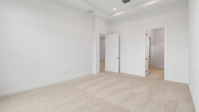 unfurnished bedroom featuring light colored carpet