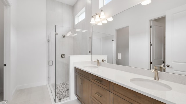 bathroom featuring vanity and an enclosed shower