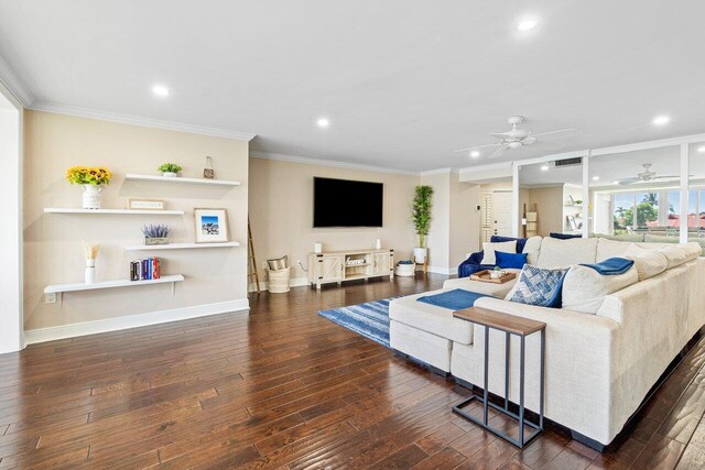 living room featuring ceiling fan, dark hardwood / wood-style floors, and ornamental molding