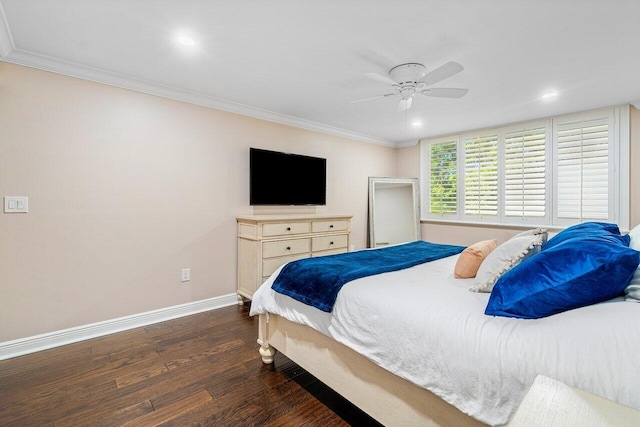 bedroom with ceiling fan, dark hardwood / wood-style floors, and ornamental molding