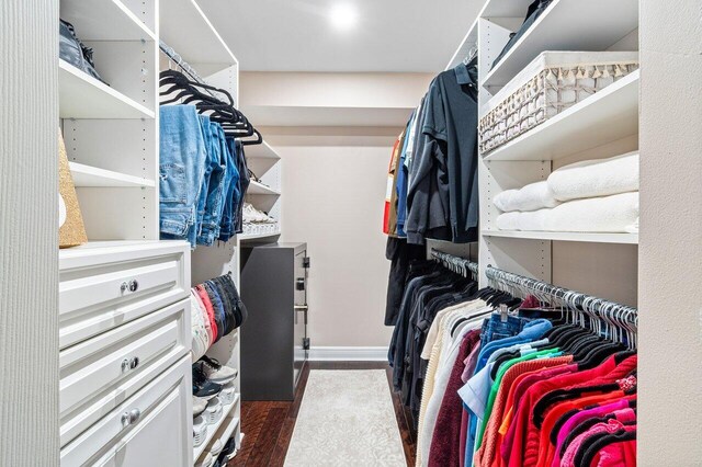 walk in closet featuring dark hardwood / wood-style flooring