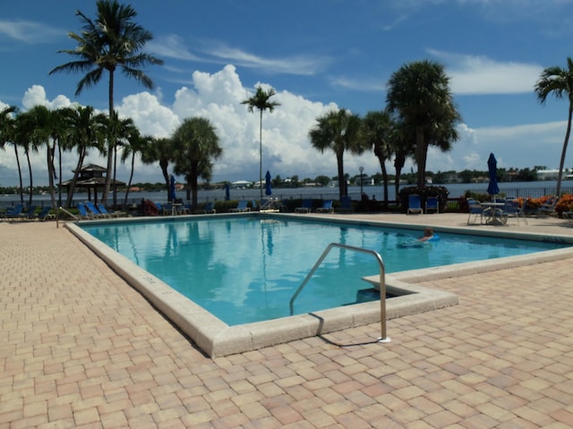 view of swimming pool featuring a patio area