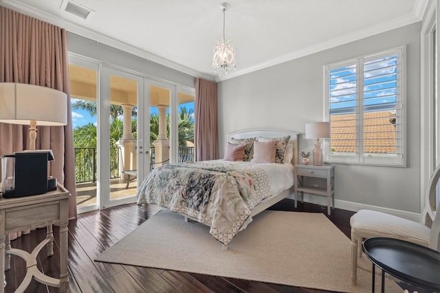 bedroom with multiple windows, crown molding, access to outside, and dark hardwood / wood-style flooring