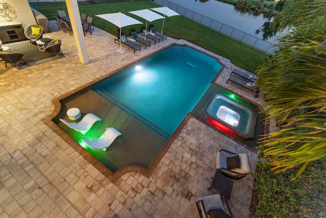 view of pool with a yard, an in ground hot tub, and a patio