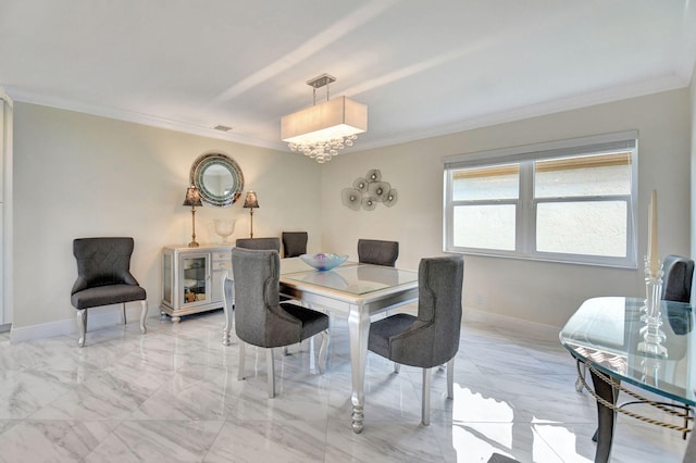 dining space with ornamental molding