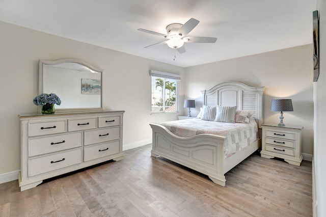 bedroom with ceiling fan and light hardwood / wood-style flooring