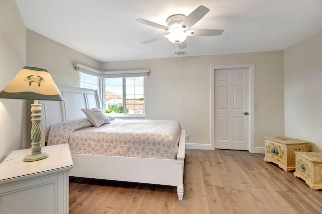 bedroom featuring light hardwood / wood-style floors and ceiling fan