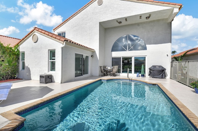 rear view of property featuring a patio area