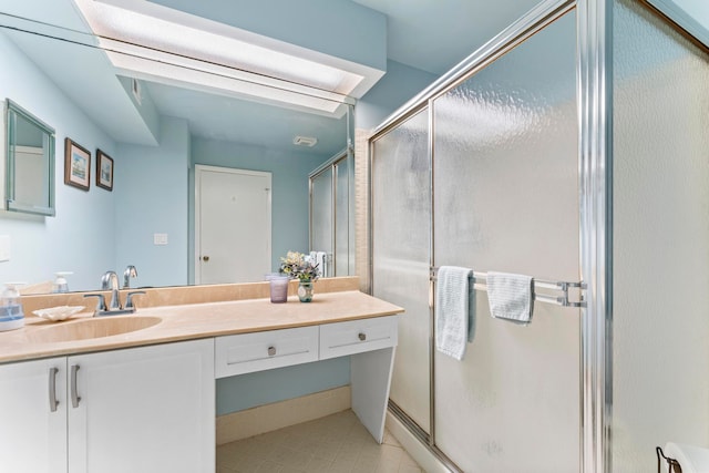 bathroom featuring tile patterned flooring, vanity, and a shower with door