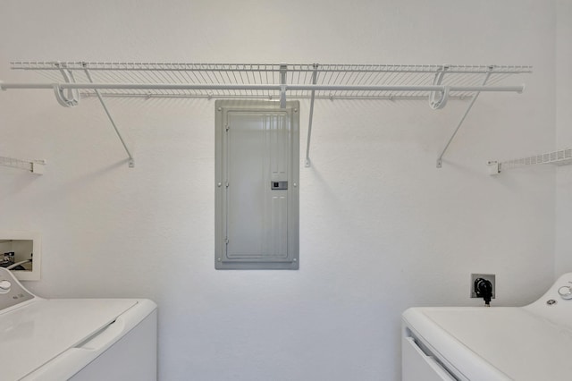 laundry room with washer and clothes dryer and electric panel