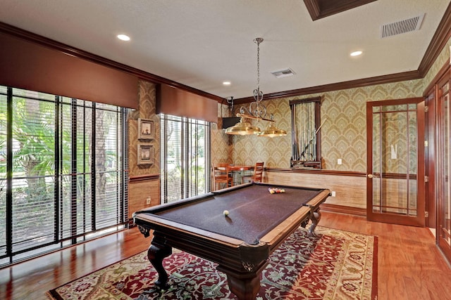 game room with wood-type flooring, a textured ceiling, billiards, and crown molding