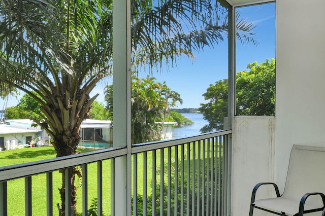 balcony featuring a water view