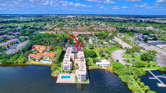 birds eye view of property with a water view