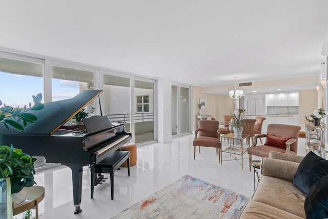 living room featuring a chandelier and light tile patterned floors