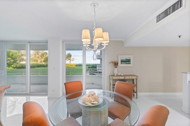 tiled dining space featuring a notable chandelier and crown molding