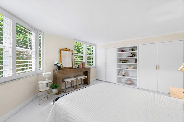 bedroom featuring a closet and light tile patterned floors