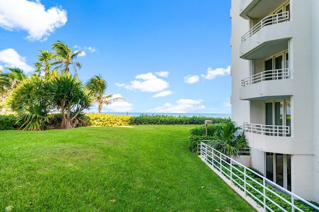 view of yard featuring a balcony