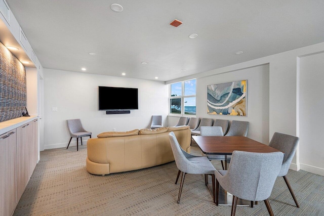 dining room with light colored carpet