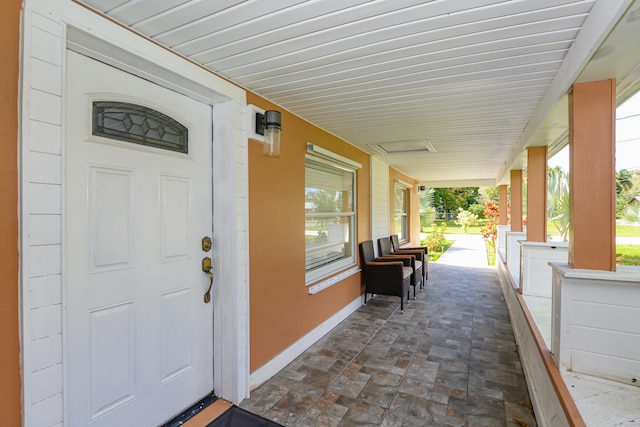 doorway to property featuring covered porch