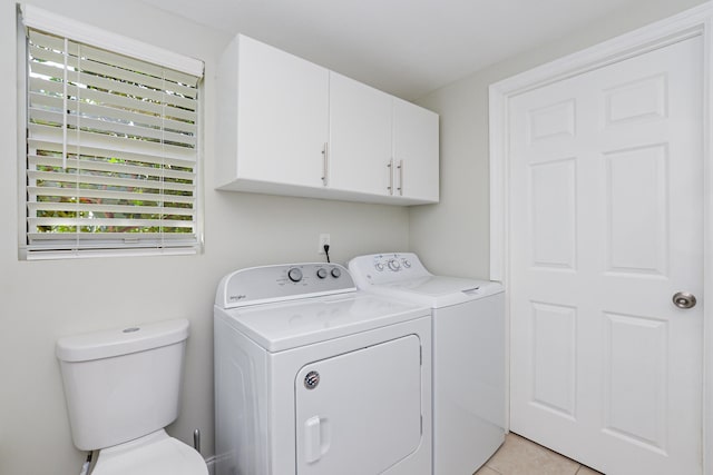 clothes washing area featuring independent washer and dryer and light tile patterned flooring