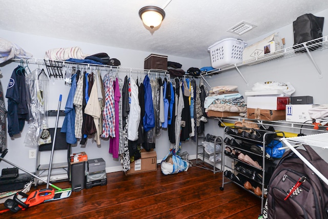 walk in closet featuring hardwood / wood-style floors