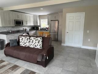 kitchen with decorative backsplash and stainless steel appliances