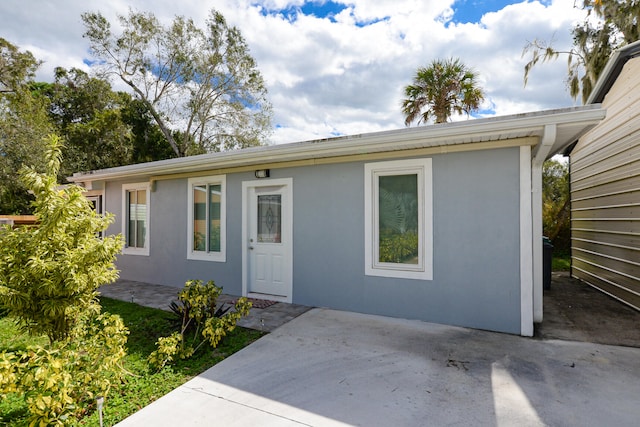 single story home featuring a patio