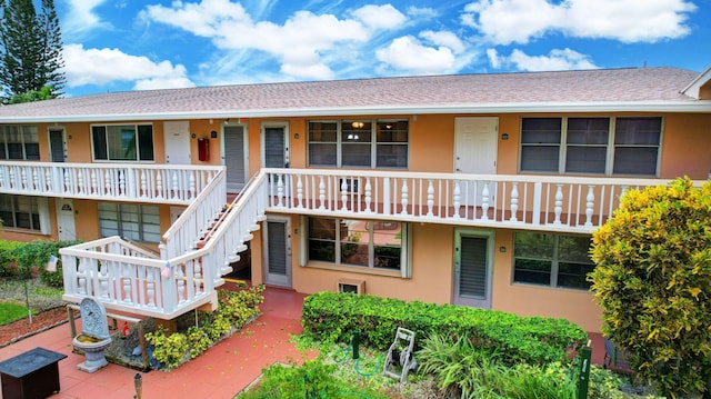 view of front of home featuring covered porch and stucco siding