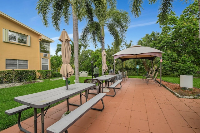 surrounding community featuring a patio, a gazebo, and a yard