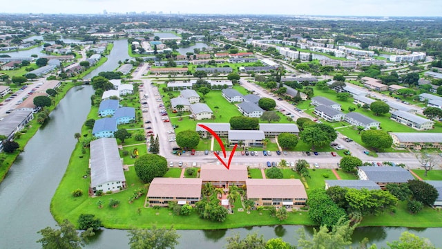 birds eye view of property featuring a water view