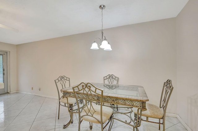 dining area featuring ceiling fan with notable chandelier and light tile patterned floors