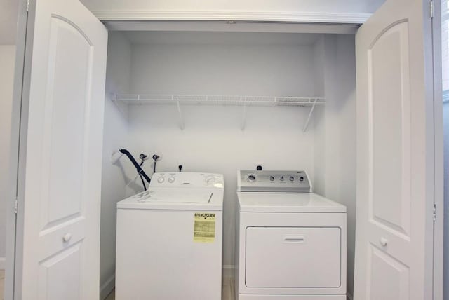 laundry room with washing machine and dryer