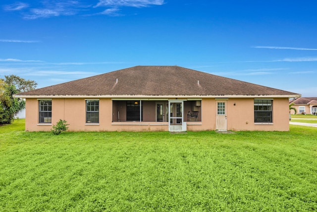 back of house with a yard