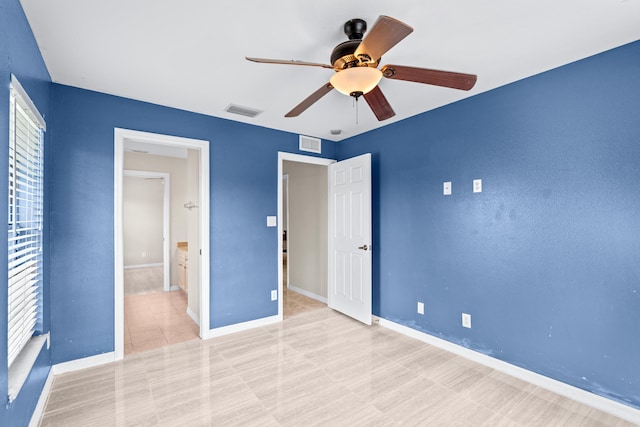 unfurnished bedroom featuring ceiling fan