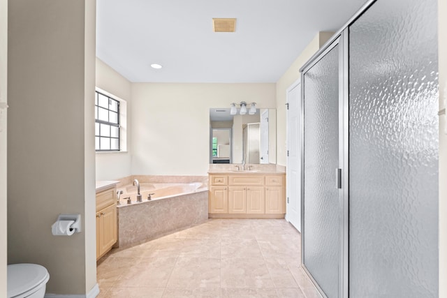 full bathroom featuring vanity, independent shower and bath, toilet, and tile patterned flooring