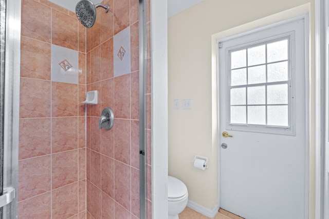 bathroom with toilet and a shower with shower door