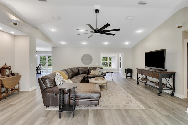 living room with french doors, ceiling fan, high vaulted ceiling, and light wood-type flooring