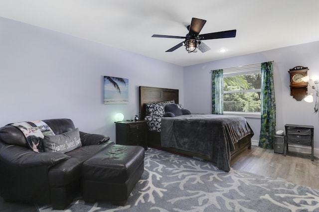 bedroom featuring ceiling fan and wood-type flooring