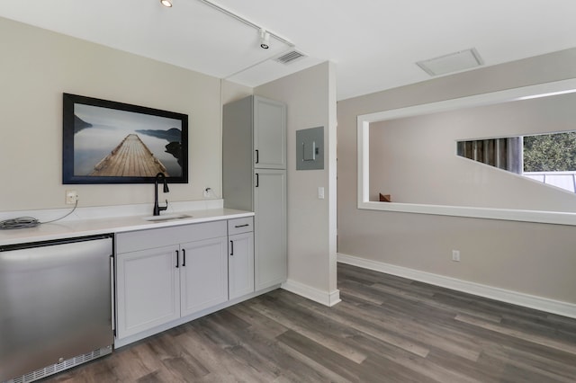 interior space with vanity and hardwood / wood-style flooring