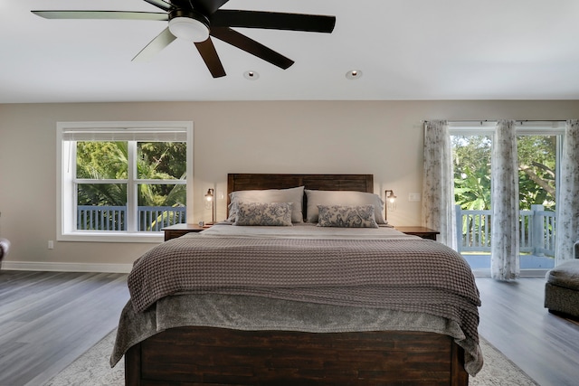 bedroom with access to exterior, ceiling fan, and wood-type flooring